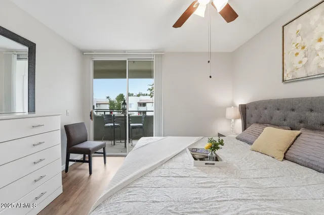 a bedroom with a bed and chair