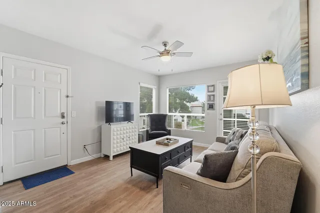 a living room with furniture and a window