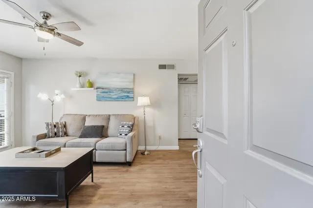 a en suite bathroom with a double vanity sink and a mirror