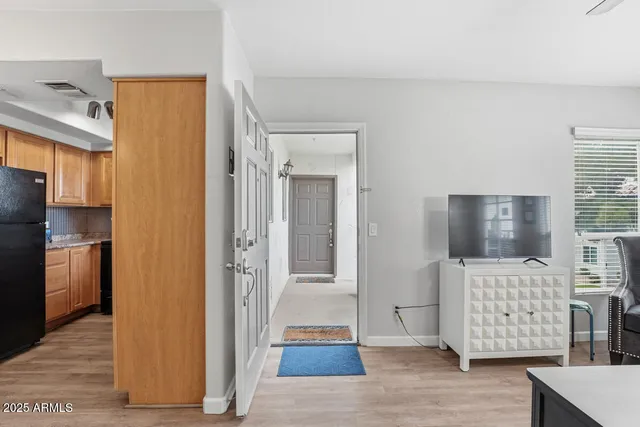 a view of entryway with wooden floor