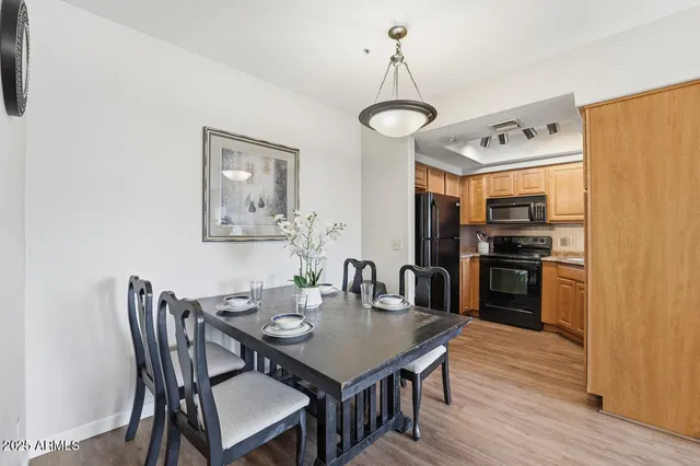 a view of a dining room with furniture and wooden floor