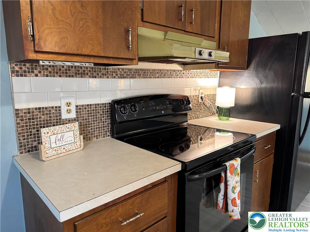 1071 Bitternut Road Walnutport, PA 18088 - Photo 27 of 39 a kitchen with a stove and a microwave