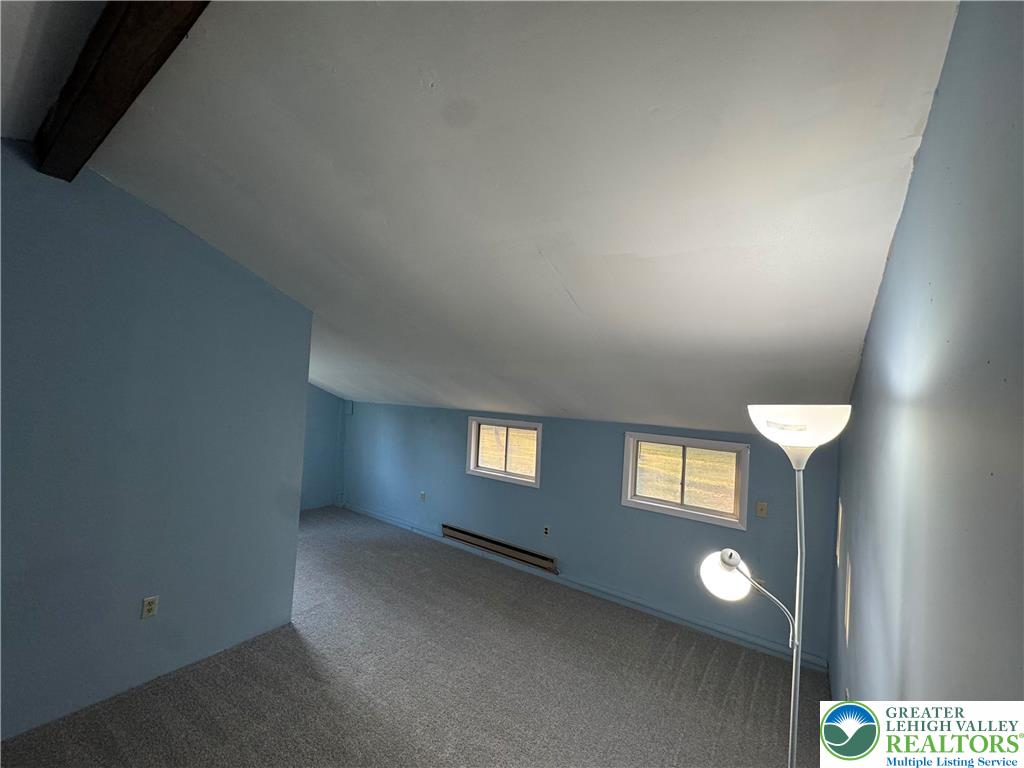 1071 Bitternut Road Walnutport, PA 18088 - Photo 29 of 39 a view of an empty room with a window and a kitchen