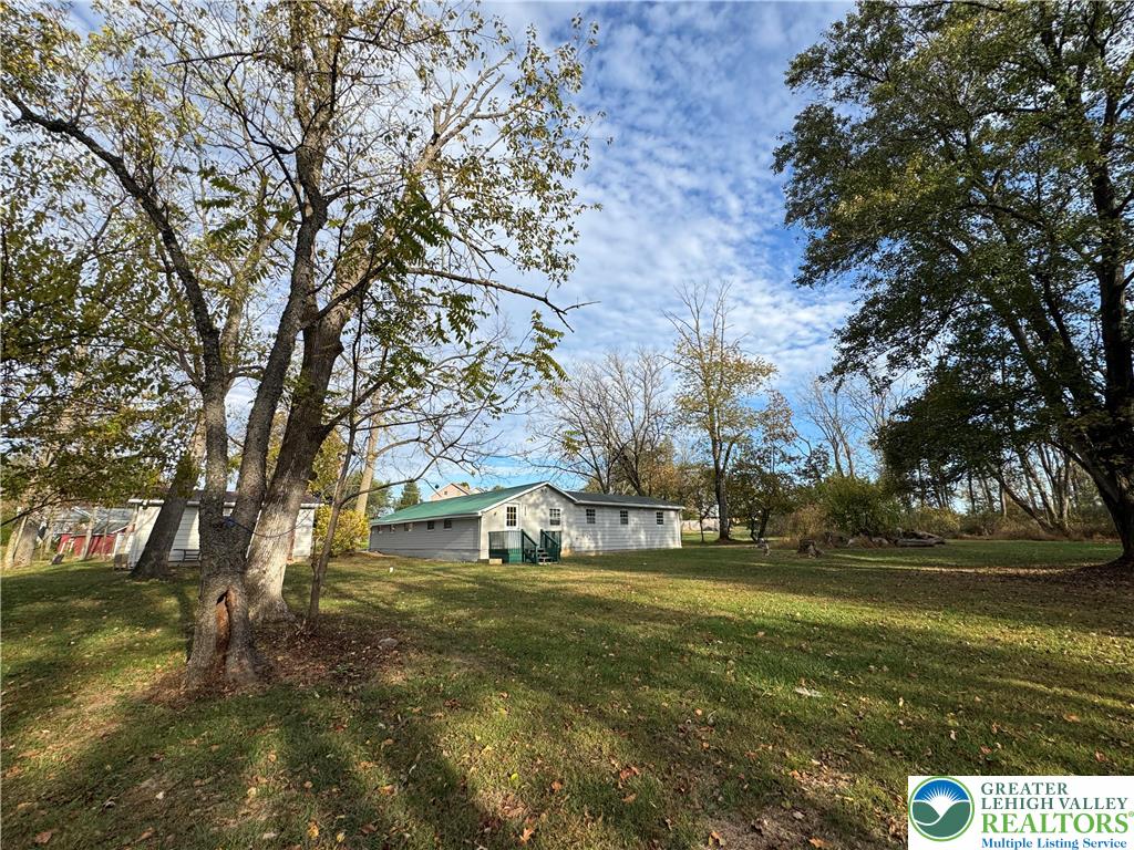 1071 Bitternut Road Walnutport, PA 18088 - Photo 3 of 39 a view of yard with green space and trees