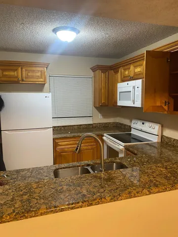 a view of a parking space with wooden floor