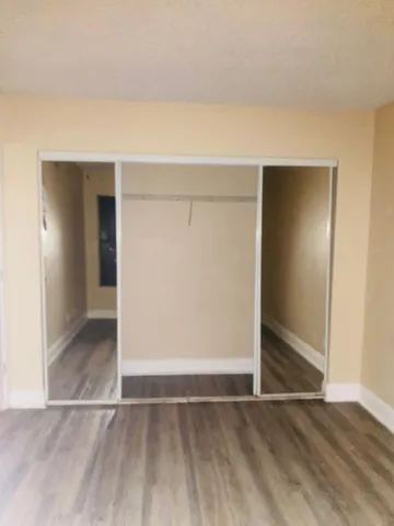 a bathroom with a granite countertop shower and a sink