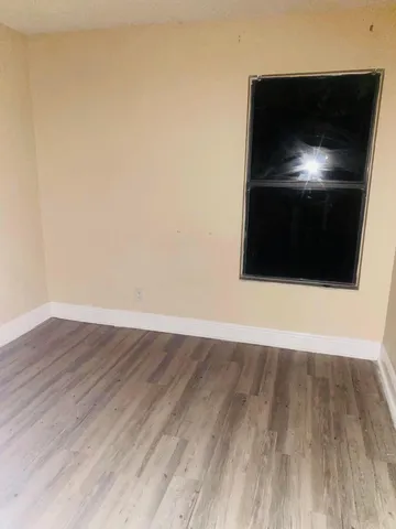 a bathroom with a shower and a toilet