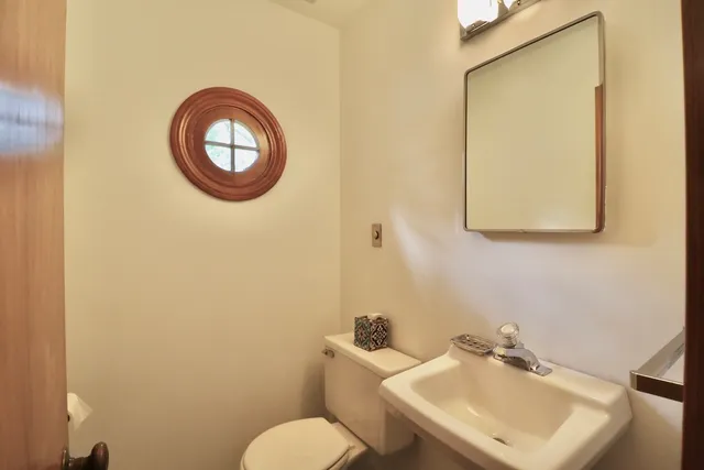a bathroom with a toilet and a sink