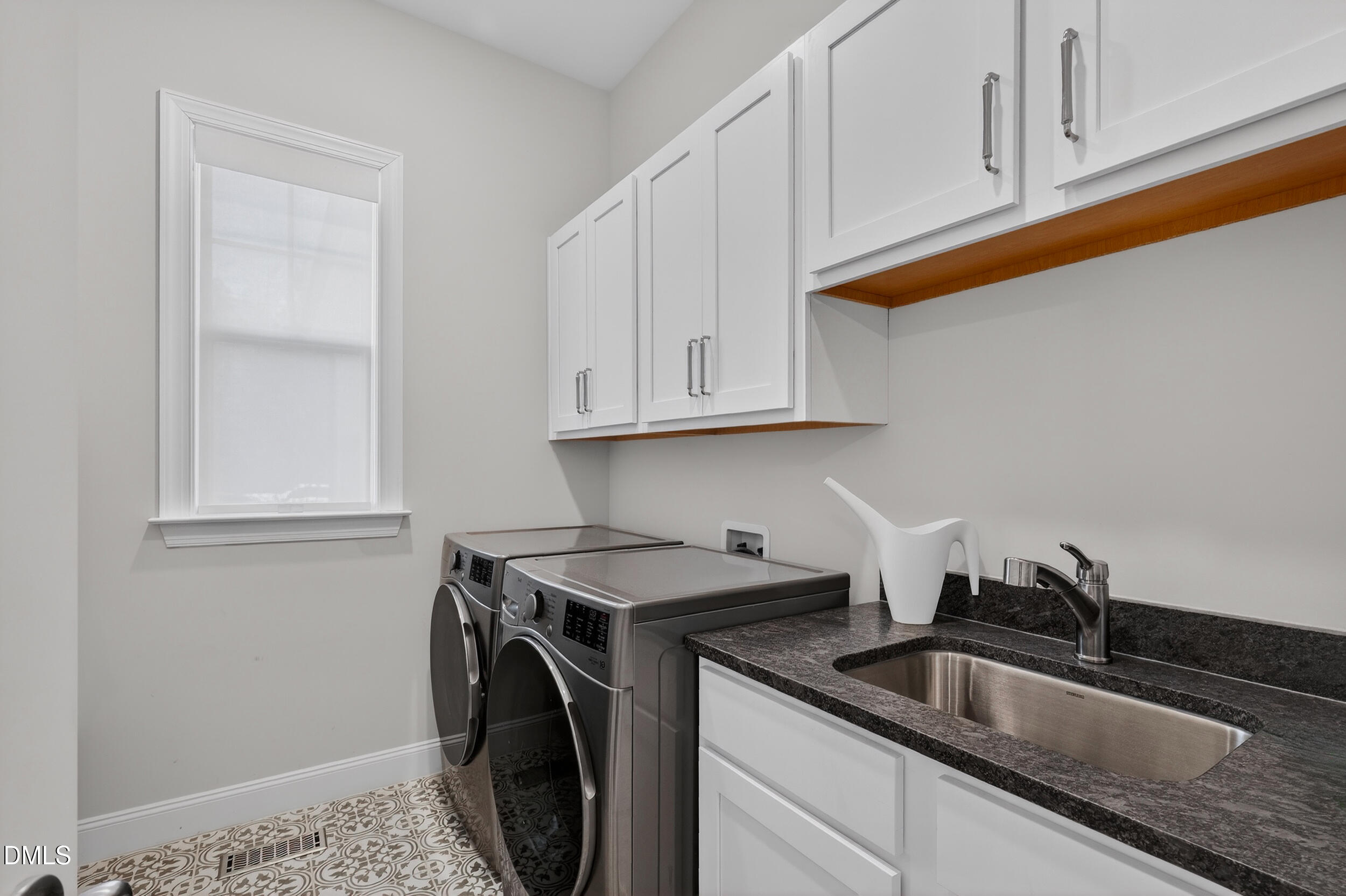 210 Lookout Ridge Pittsboro, NC 27312 - Photo 48 of 59 a kitchen with stainless steel appliances granite countertop a sink a stove and cabinets