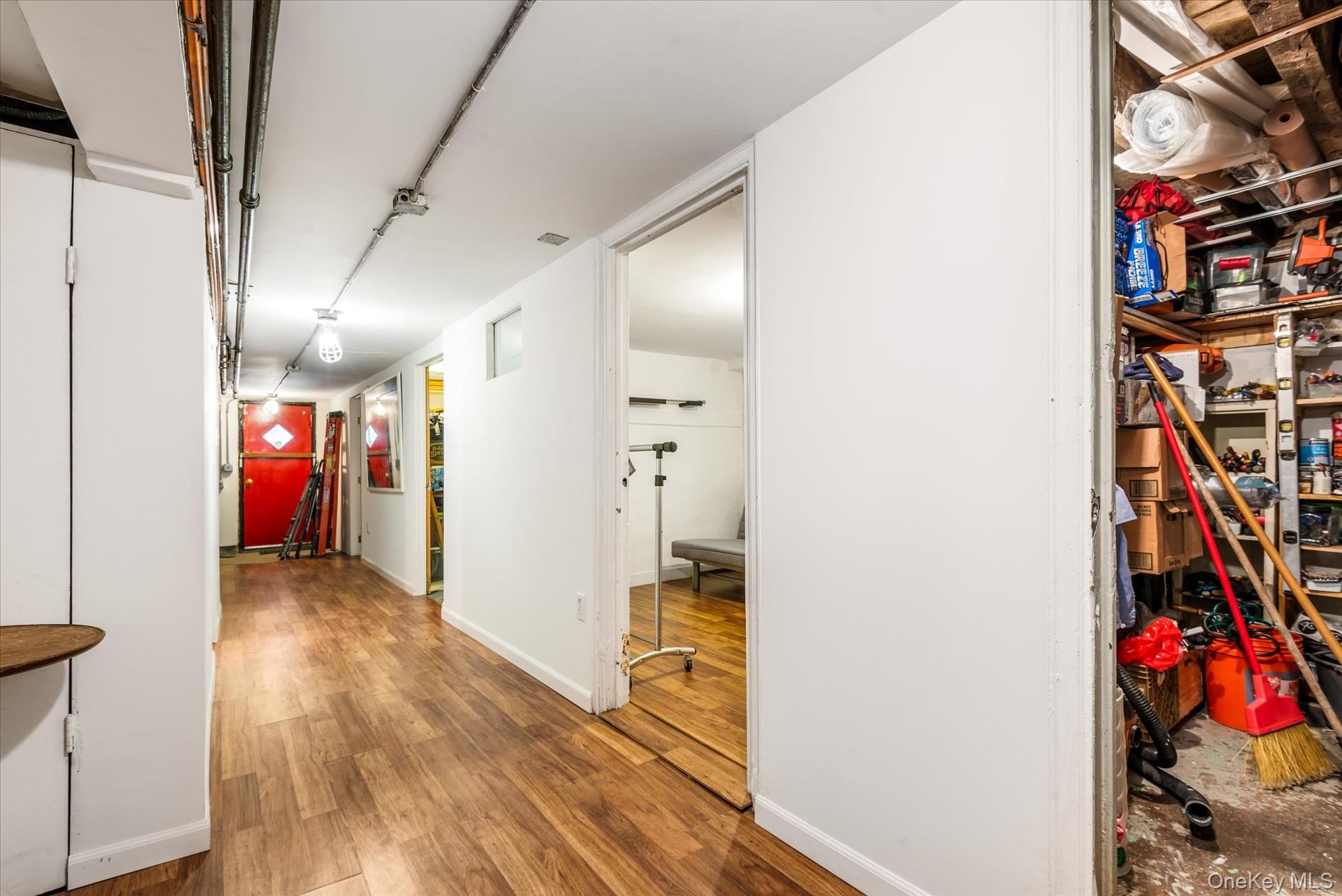 26-19 14th Place Queens, NY 11102 - Photo 32 of 33 Hall with wood finished floors and baseboards