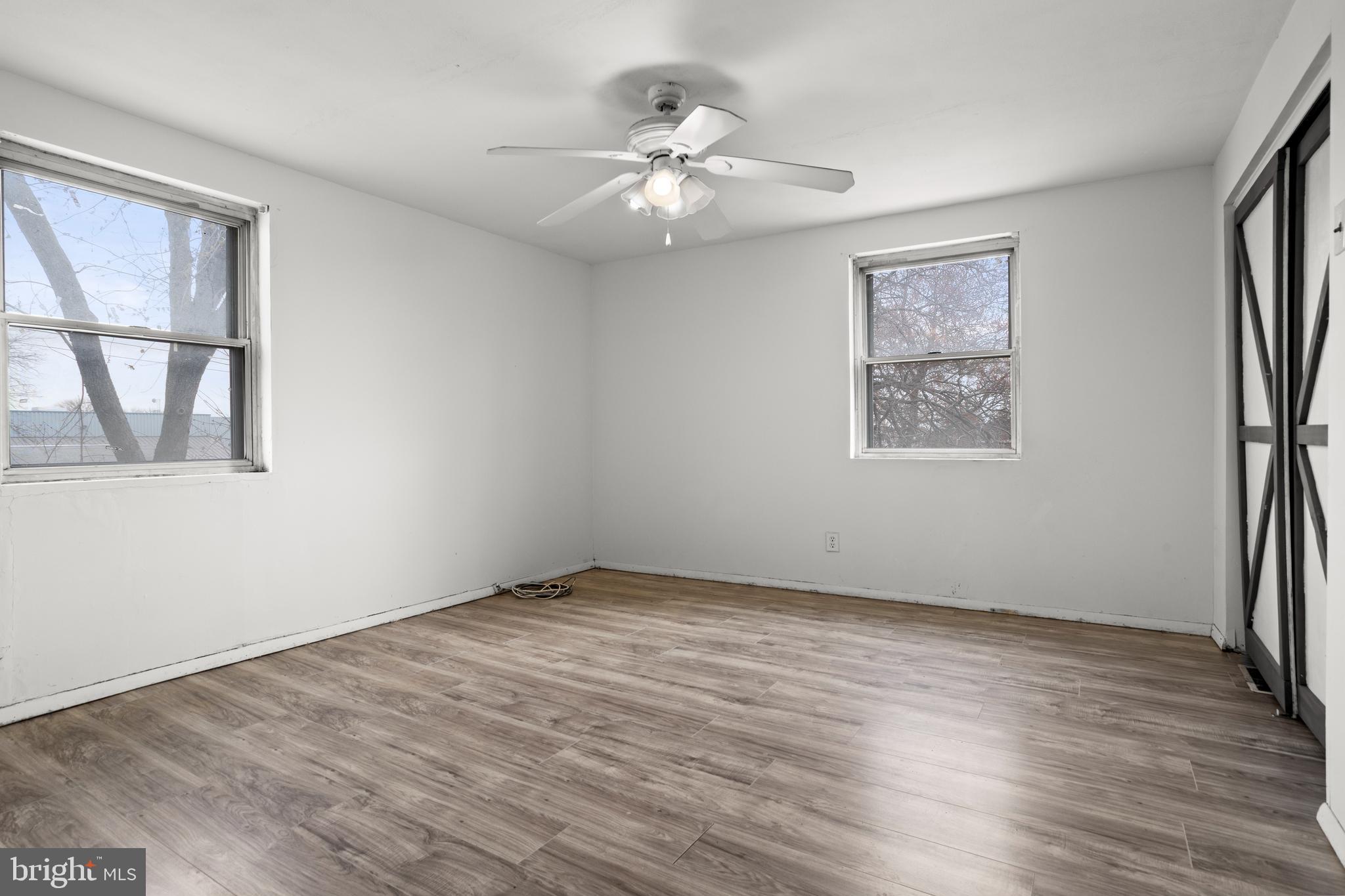 1900 Fowler Road Folcroft, PA 19032 - Photo 14 of 24 a view of an empty room with a window and wooden floor