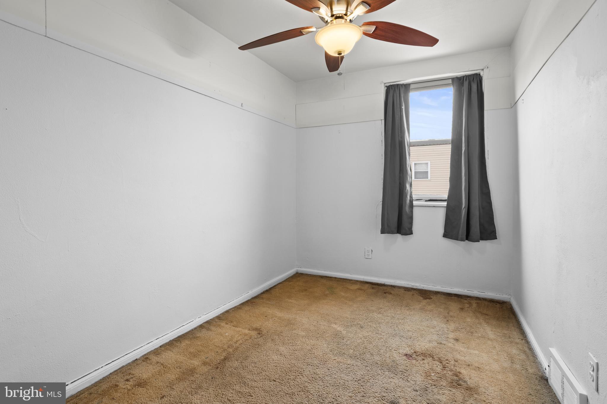 1900 Fowler Road Folcroft, PA 19032 - Photo 16 of 24 an empty room with windows and fan