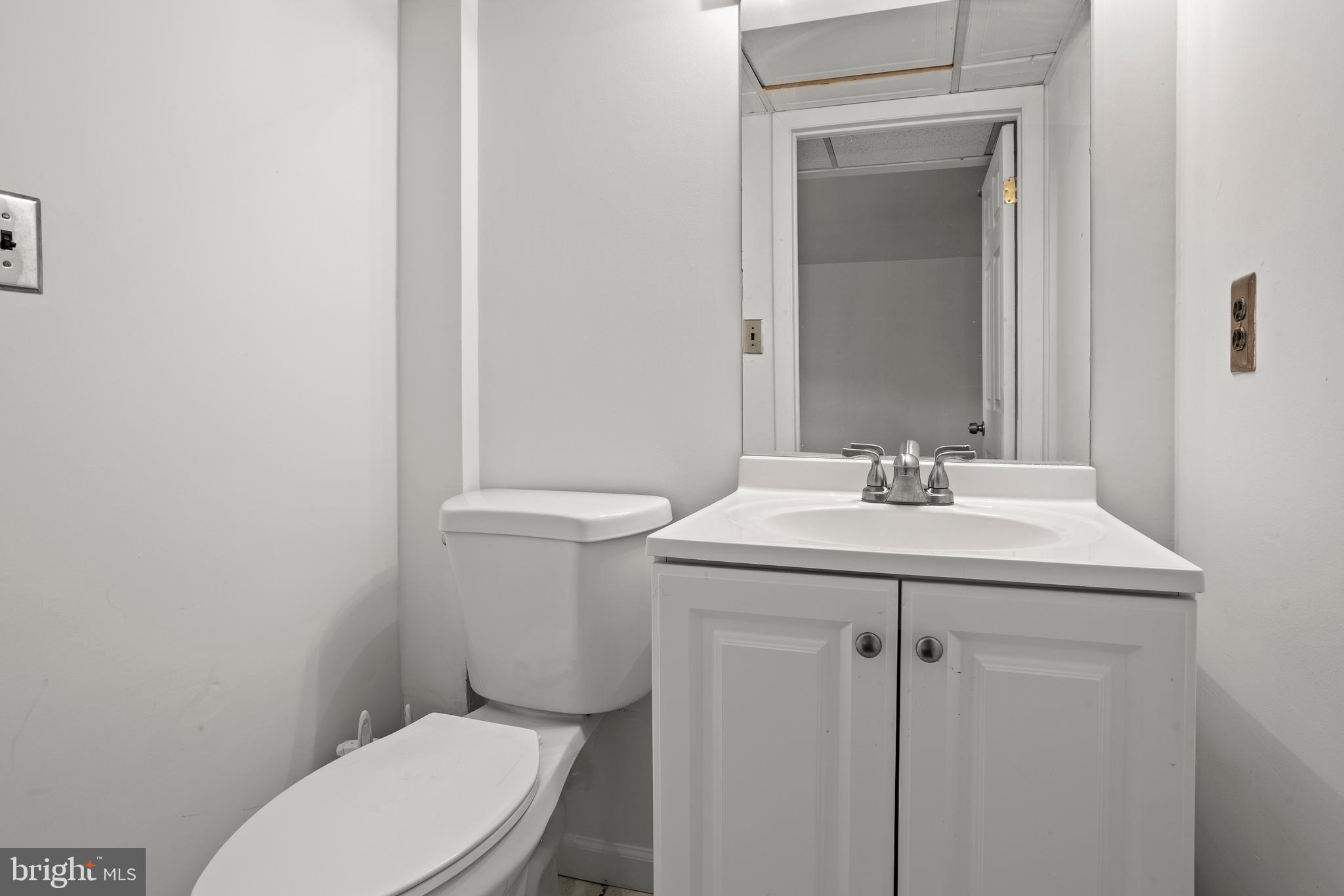 1900 Fowler Road Folcroft, PA 19032 - Photo 22 of 24 a bathroom with a sink a toilet and mirror