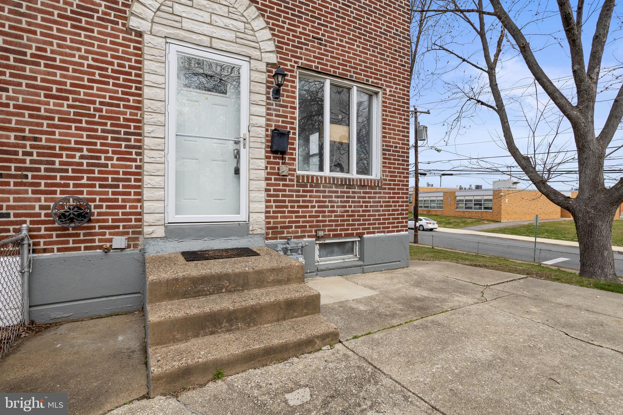 1900 Fowler Road Folcroft, PA 19032 - Photo 3 of 24 a view of a house with a door and a tree