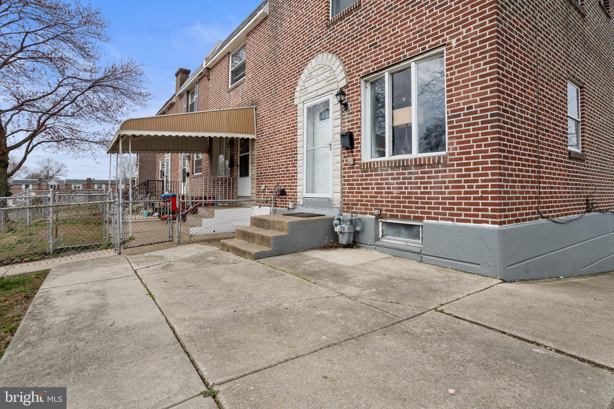 1900 Fowler Road Folcroft, PA 19032 - Photo 4 of 24 a view of a brick house with many windows