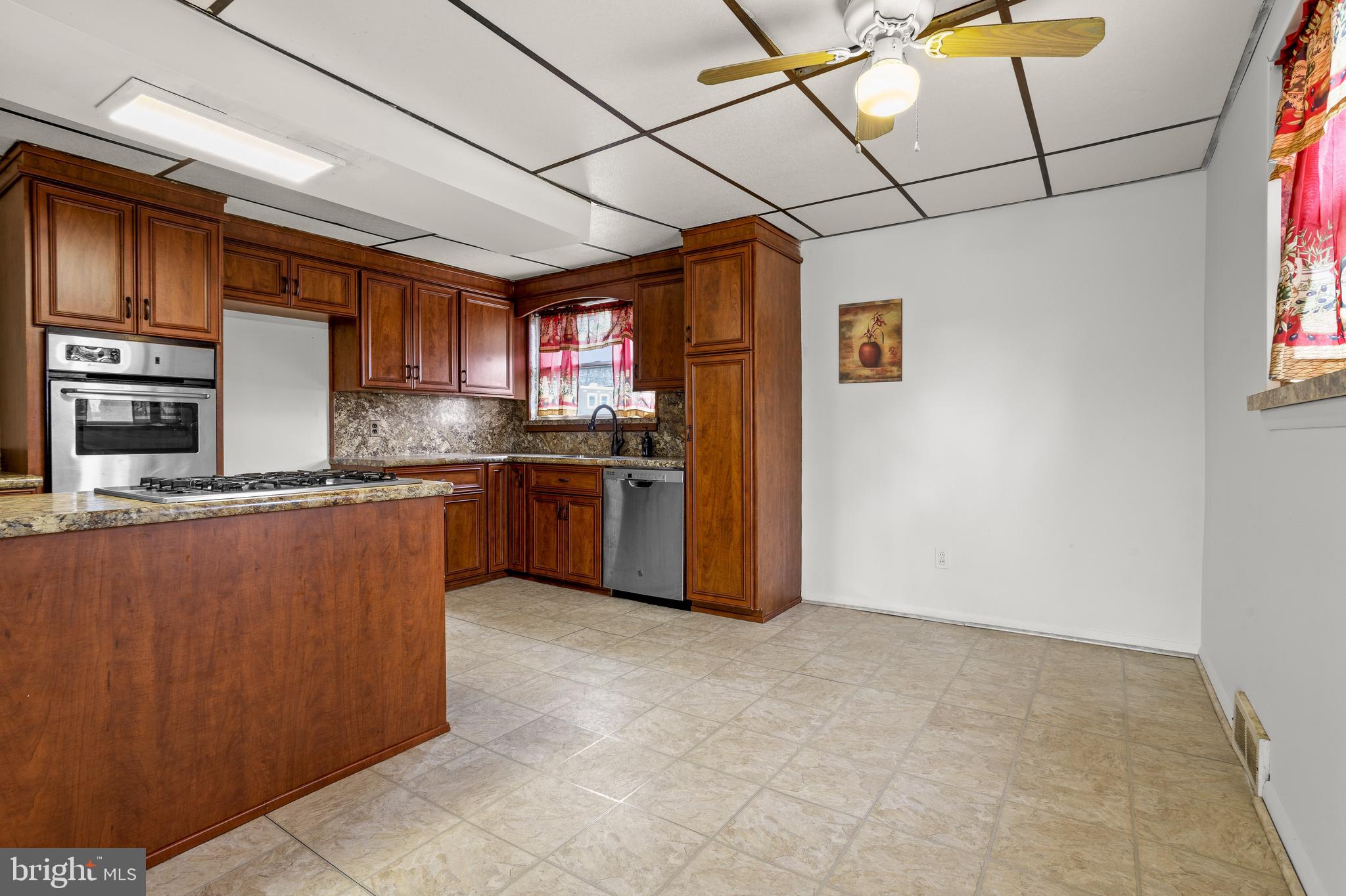 1900 Fowler Road Folcroft, PA 19032 - Photo 9 of 24 a kitchen with stainless steel appliances granite countertop a stove a sink dishwasher and a refrigerator