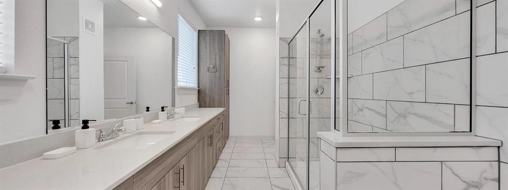 10030 Garland Road, Unit 1404 Dallas, TX 75218 - Photo 11 of 17 a bathroom with a double vanity sink and mirror