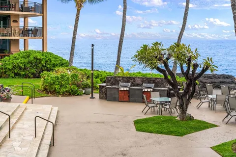 a view of a chairs and table in the patio