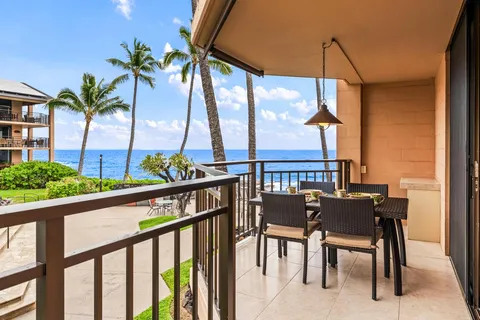 a view of a chairs and table in patio