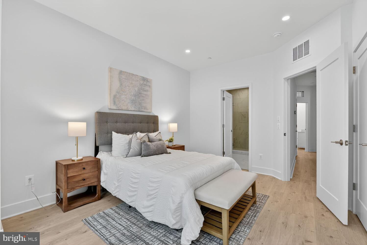 2009 Tysons Ridgeline Road Falls Church, VA 22043 - Photo 21 of 64 a bedroom with a bed and a night stand