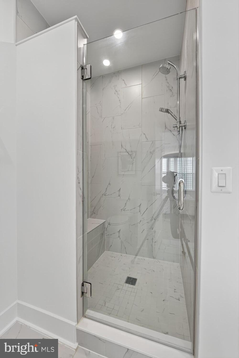 2009 Tysons Ridgeline Road Falls Church, VA 22043 - Photo 25 of 64 a bathroom with a glass shower door