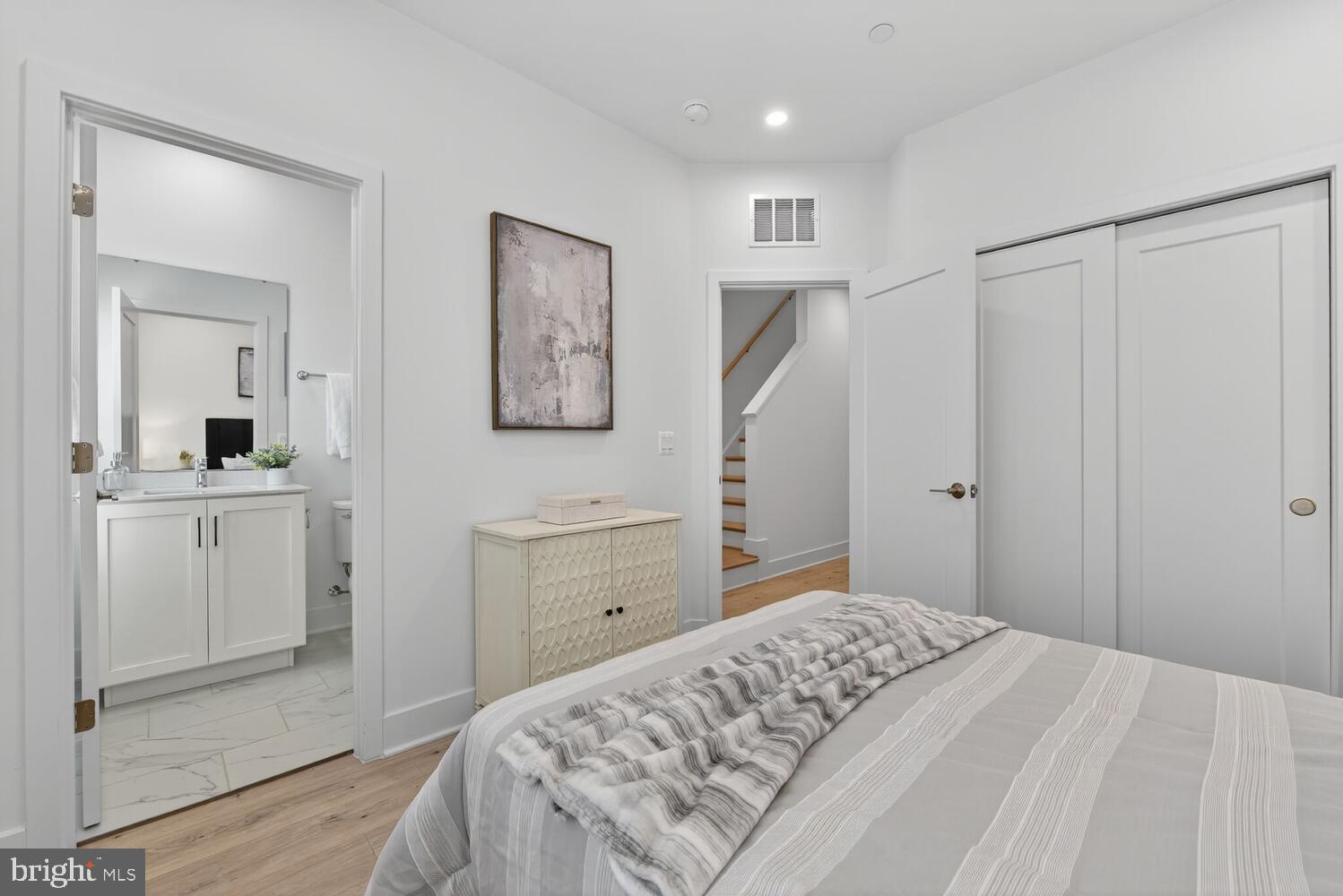 2009 Tysons Ridgeline Road Falls Church, VA 22043 - Photo 27 of 64 a bedroom with a bed and a dresser in it