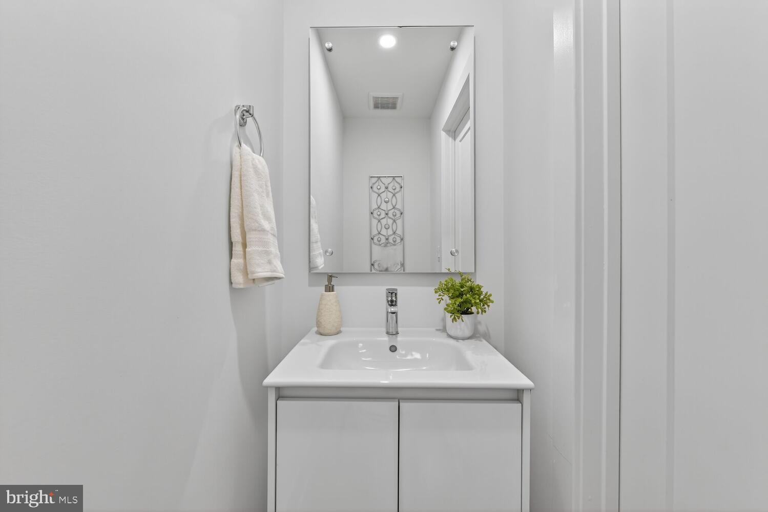 2009 Tysons Ridgeline Road Falls Church, VA 22043 - Photo 36 of 64 a bathroom with a sink and a mirror