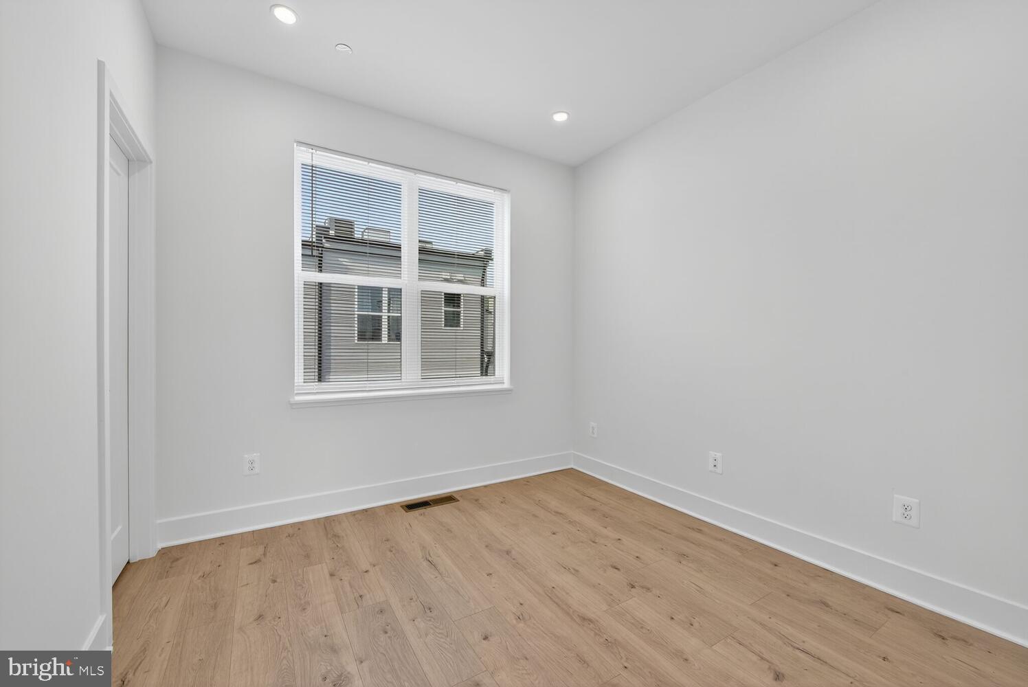 2009 Tysons Ridgeline Road Falls Church, VA 22043 - Photo 37 of 64 a view of empty room with wooden floor and fan