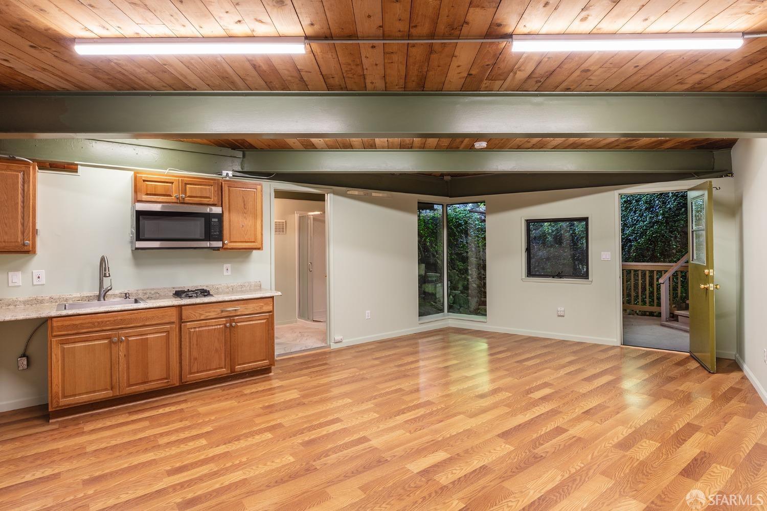 38 Sunset Drive Berkeley, CA 94707 - Photo 19 of 21 a kitchen with stainless steel appliances granite countertop a sink and cabinets