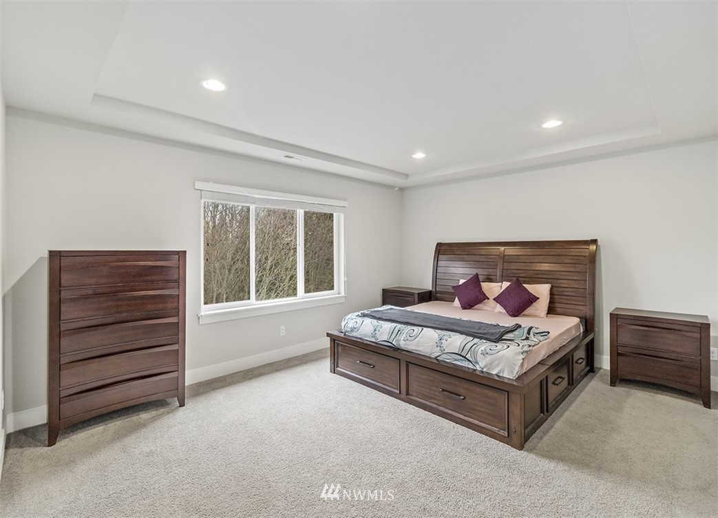 20515 3rd Avenue Southeast, Unit 14 Bothell, WA 98012 - Photo 8 of 20 a bedroom with a bed and a dresser