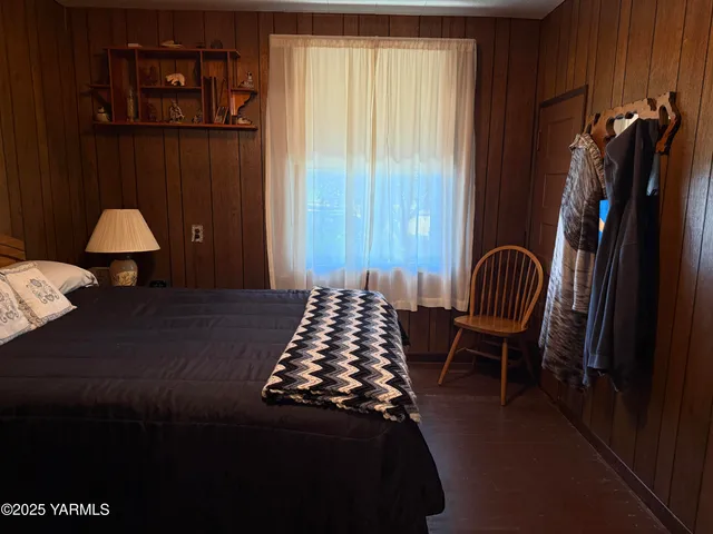 a room with a bed and a window