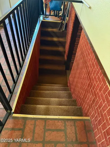 a view of a room with window and flowerpot