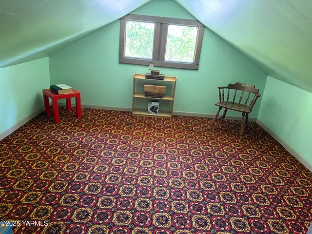 a view of entryway with a door and wooden floor