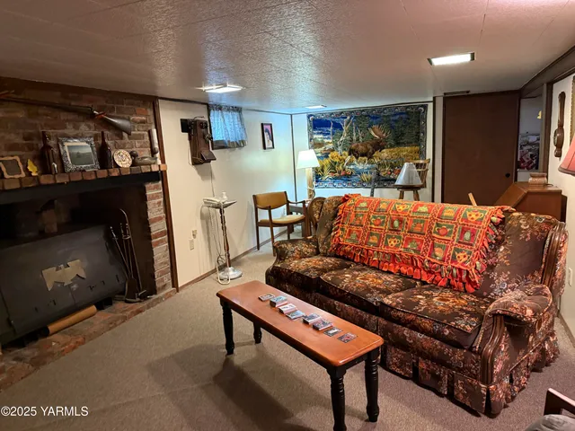 a room with furniture and a flat screen tv