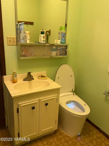 a living room with furniture and large windows