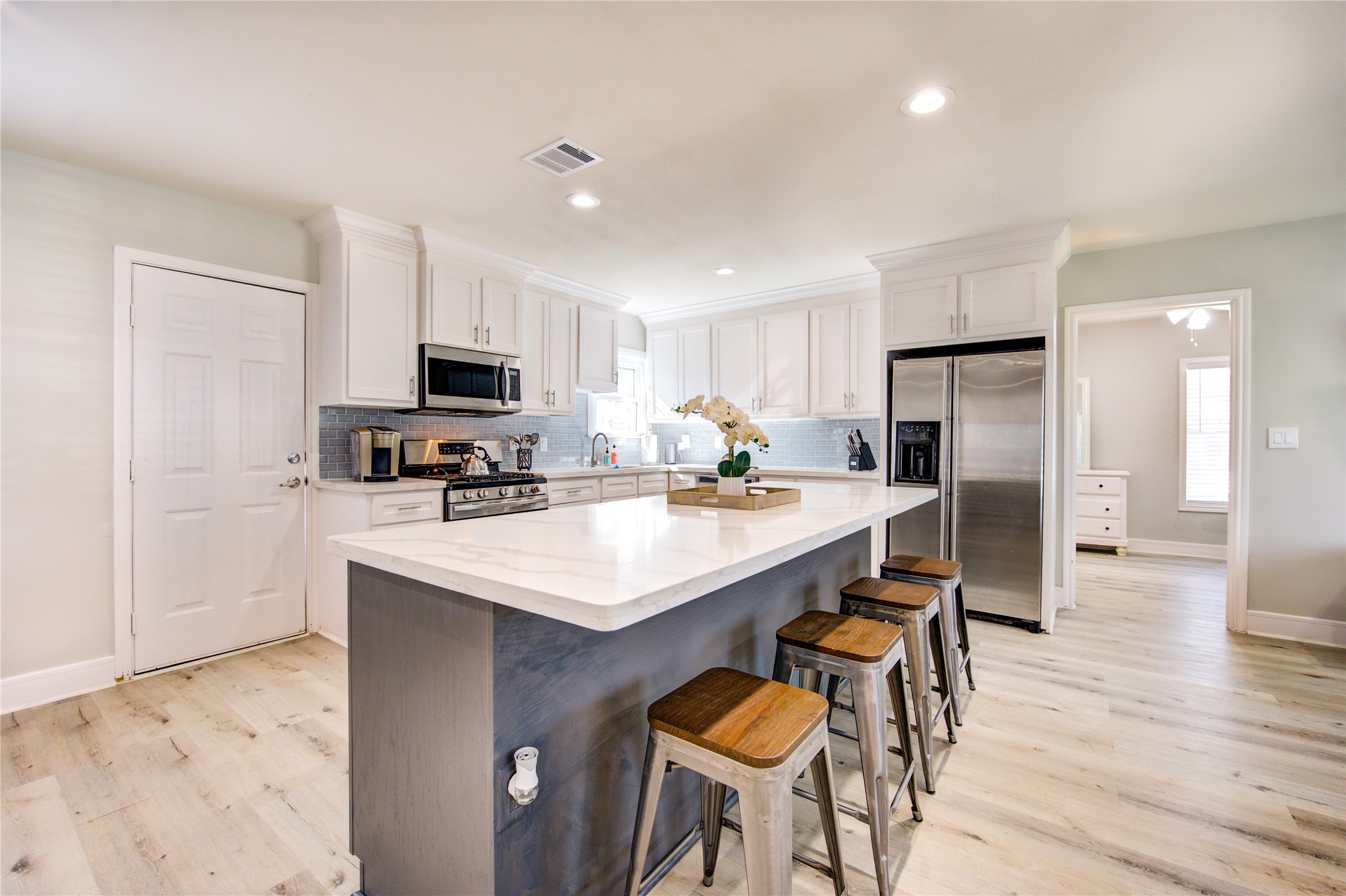 4522 Dixie Drive Houston, TX 77021 - Photo 12 of 33 a kitchen with kitchen island a sink appliances and cabinets
