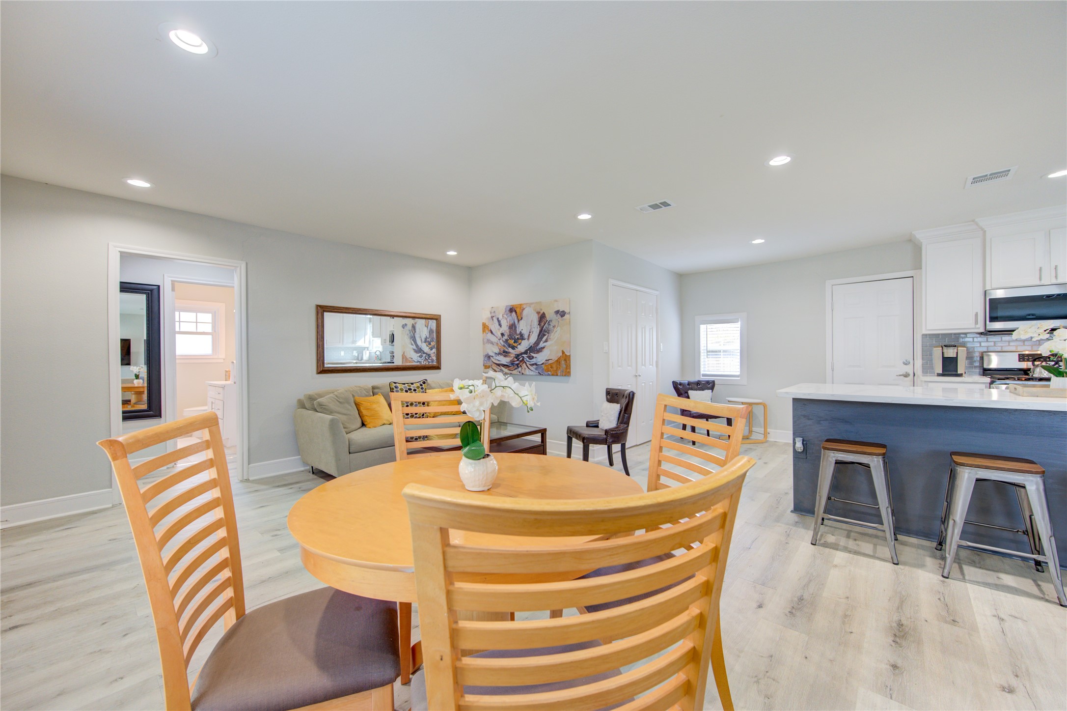 4522 Dixie Drive Houston, TX 77021 - Photo 13 of 33 a dining room with furniture a table and kitchen view
