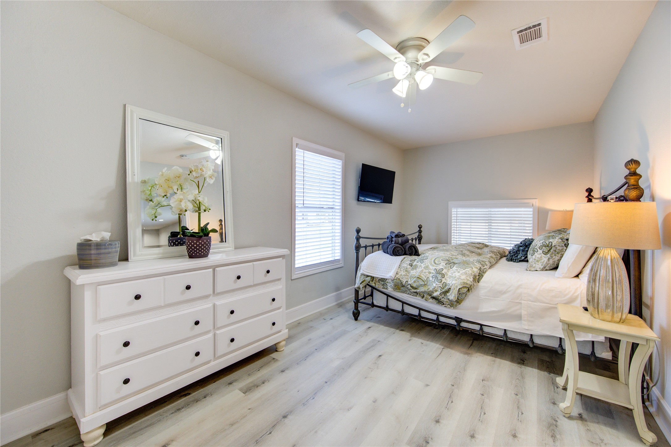 4522 Dixie Drive Houston, TX 77021 - Photo 15 of 33 a bedroom with a large bed and a chandelier