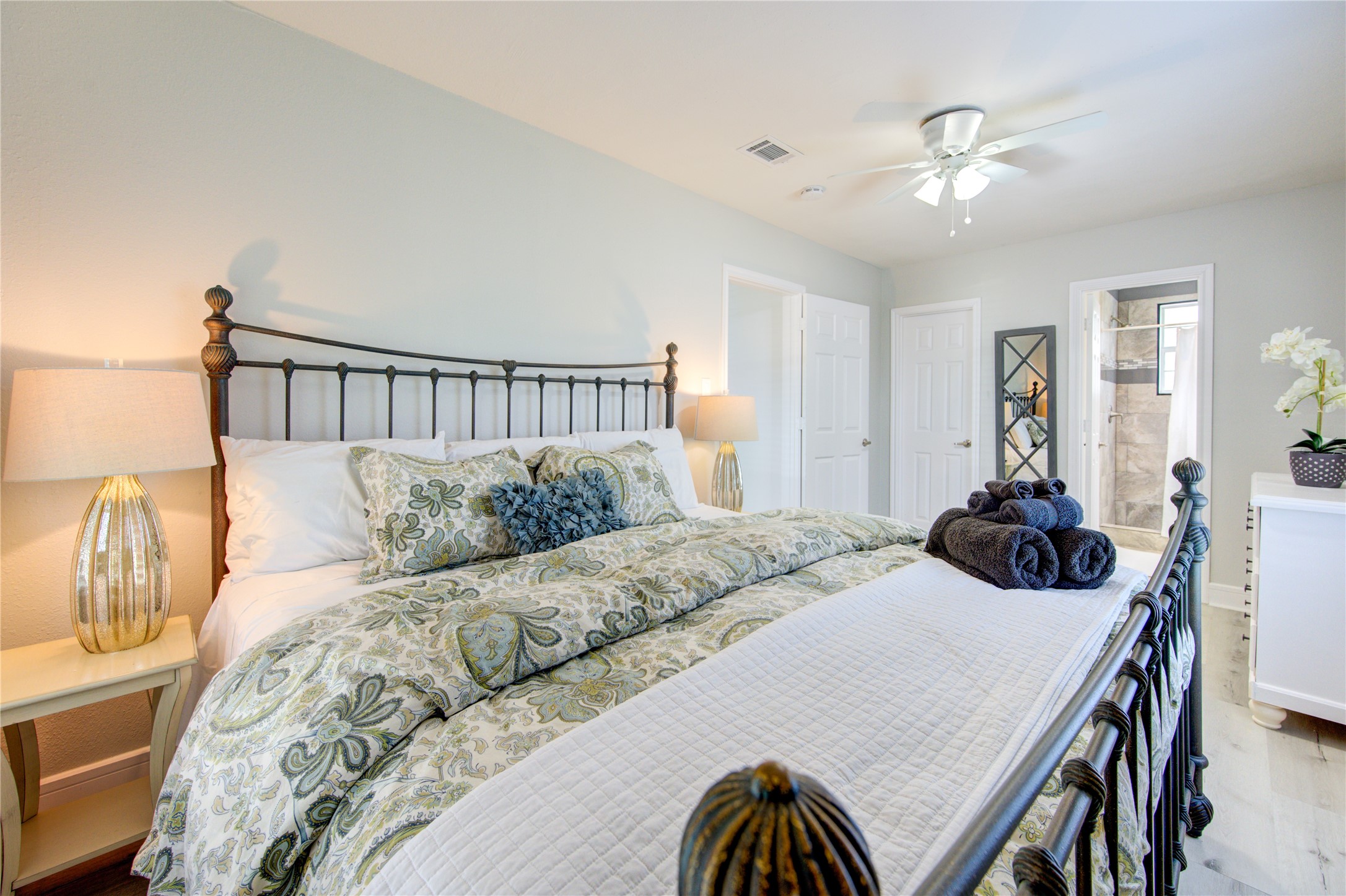 4522 Dixie Drive Houston, TX 77021 - Photo 16 of 33 a bedroom with a bed a chandelier and a dresser