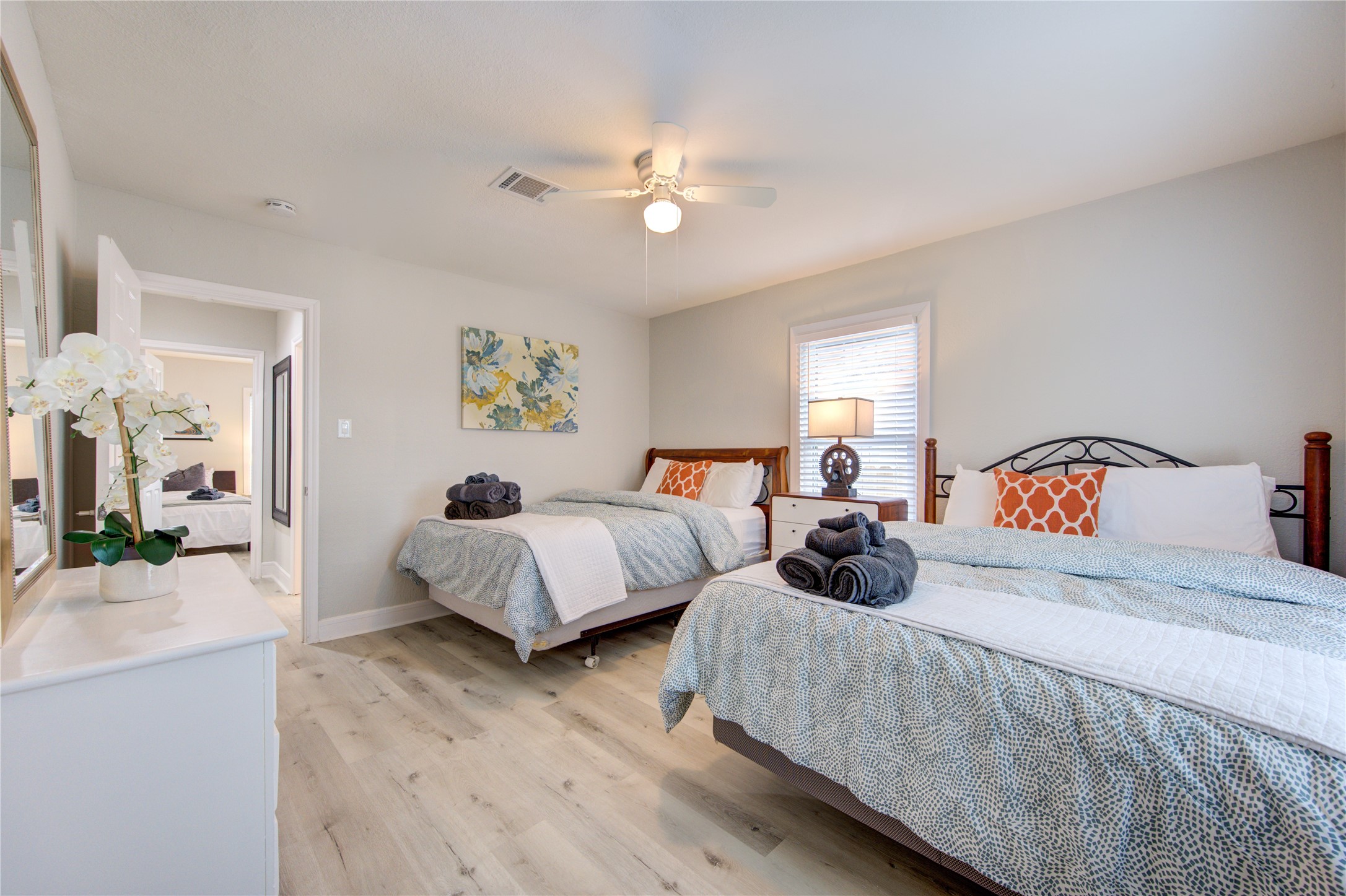 4522 Dixie Drive Houston, TX 77021 - Photo 19 of 33 a bedroom with two beds and a chandelier