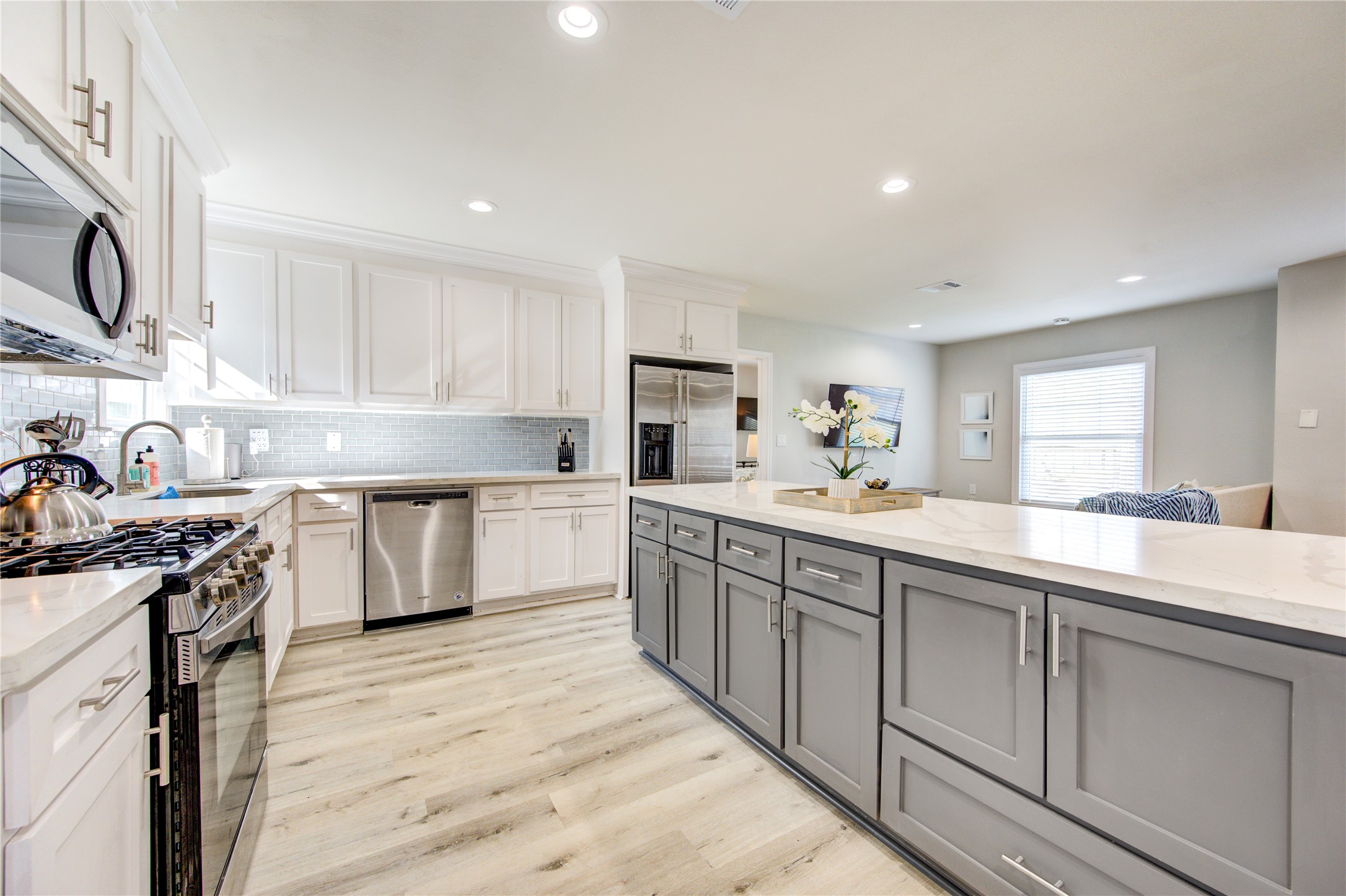 4522 Dixie Drive Houston, TX 77021 - Photo 9 of 33 a kitchen with a sink stove cabinets and wooden floor
