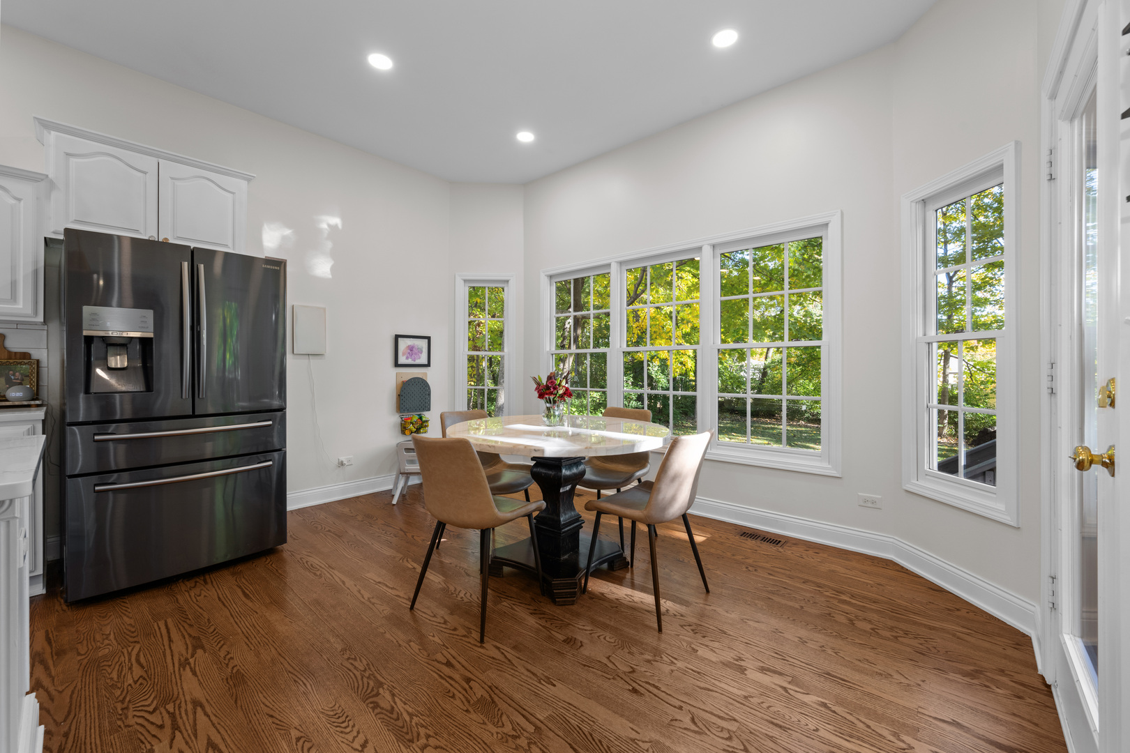 408 Delaware Circle Bolingbrook, IL 60440 - Photo 15 of 47 a kitchen with stainless steel appliances a dining table chairs and refrigerator