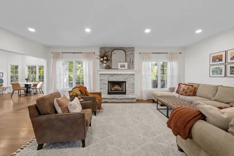 a living room with furniture and a fireplace