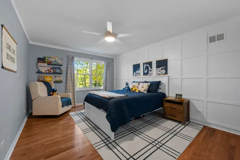 a bedroom with a bed and a couch