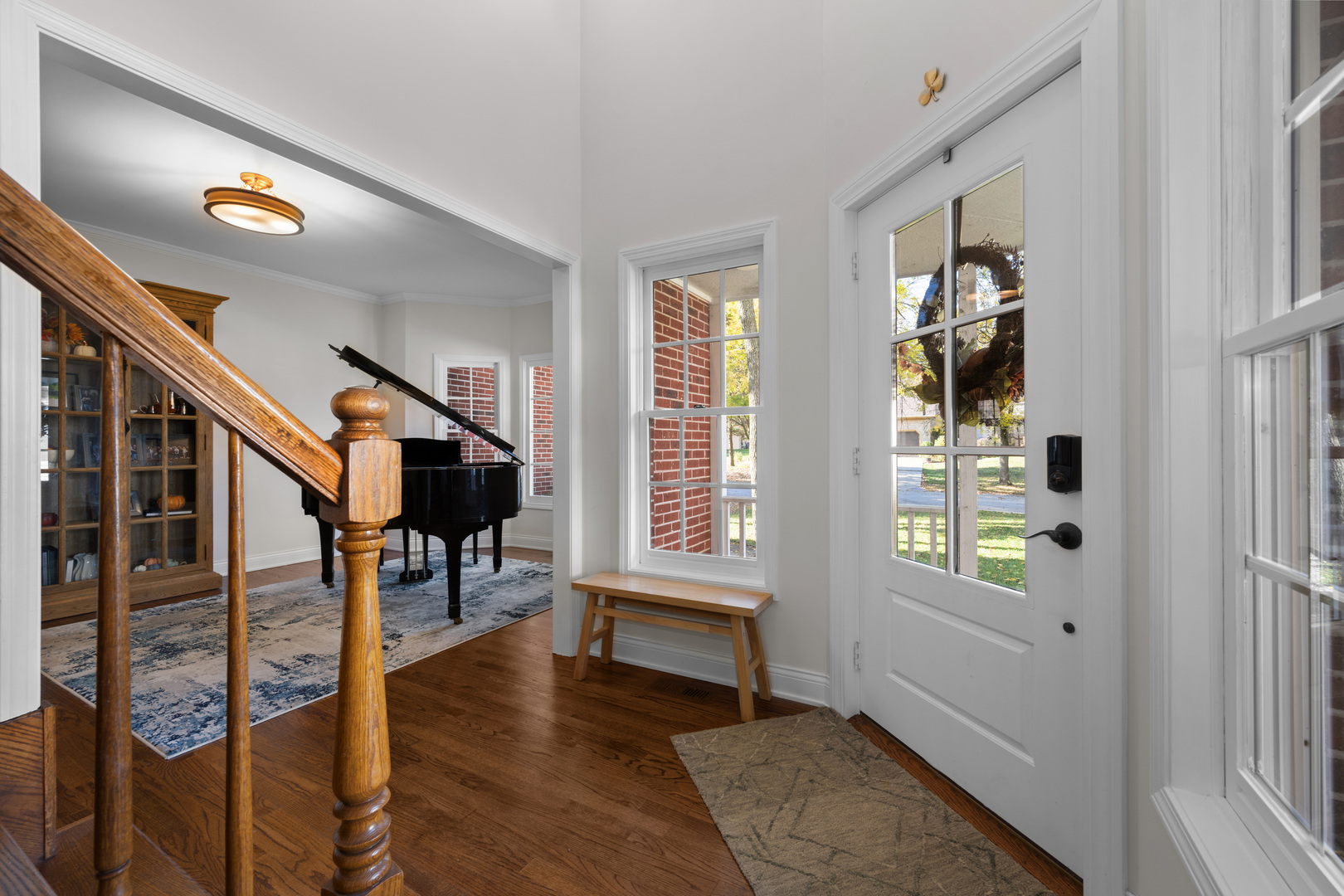 408 Delaware Circle Bolingbrook, IL 60440 - Photo 5 of 47 a view of an entryway with wooden floor windows and a livingroom