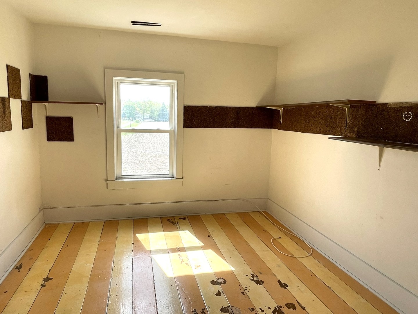 6808 South Oak Grove Road Harvard, IL 60033 - Photo 13 of 18 a view of an empty room and a window