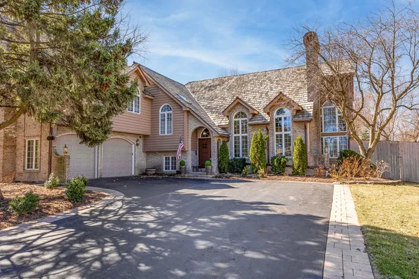 a view of a large house with a street