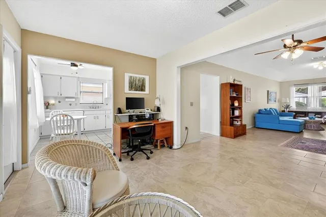 a bedroom with furniture and a window