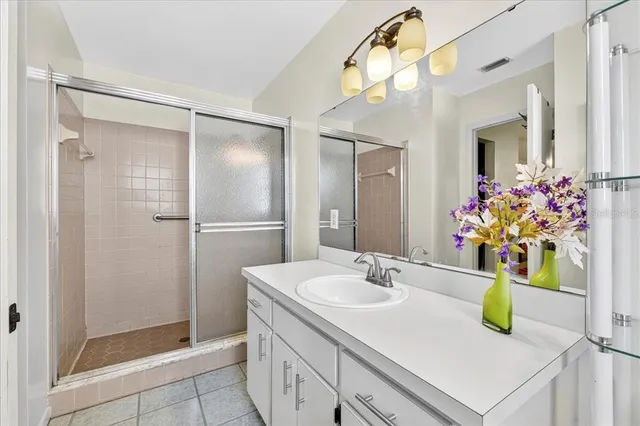 a bathroom with a sink vanity and a mirror