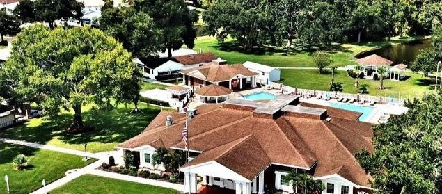 an aerial view of multiple houses with yard